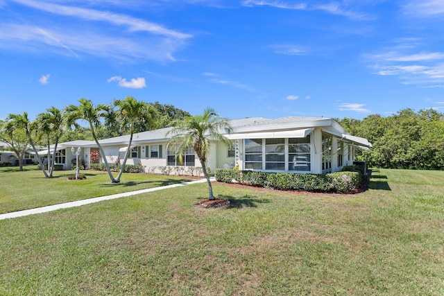 single story home with a front yard