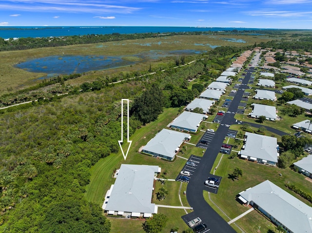 birds eye view of property featuring a water view