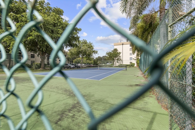 view of sport court with basketball hoop