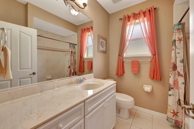 bathroom featuring toilet, tile patterned flooring, and vanity