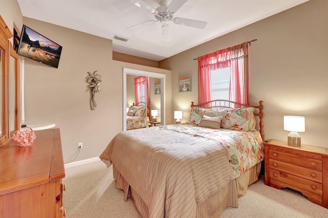 carpeted bedroom featuring ceiling fan