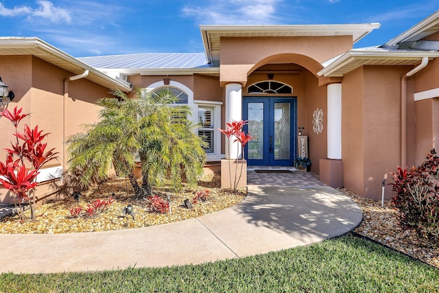 doorway to property featuring french doors