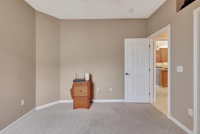 unfurnished bedroom with light colored carpet