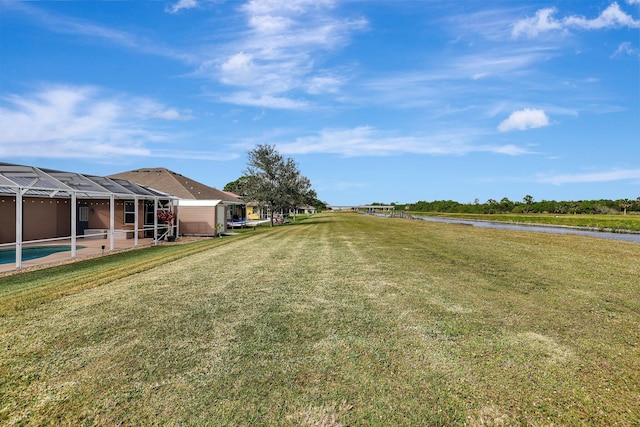 view of yard with glass enclosure