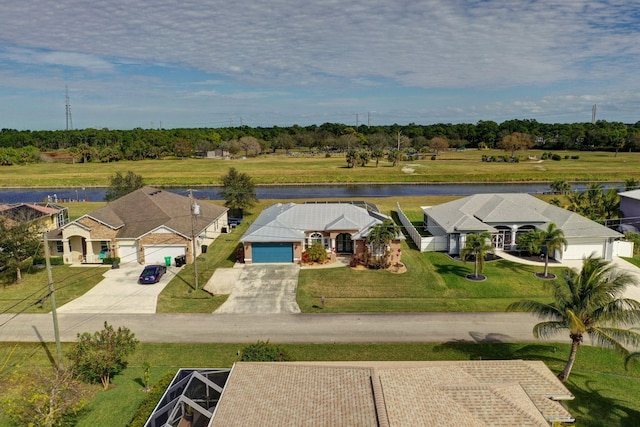 birds eye view of property featuring a water view