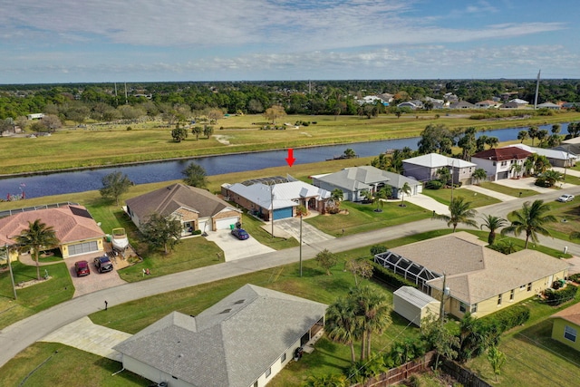 drone / aerial view with a water view