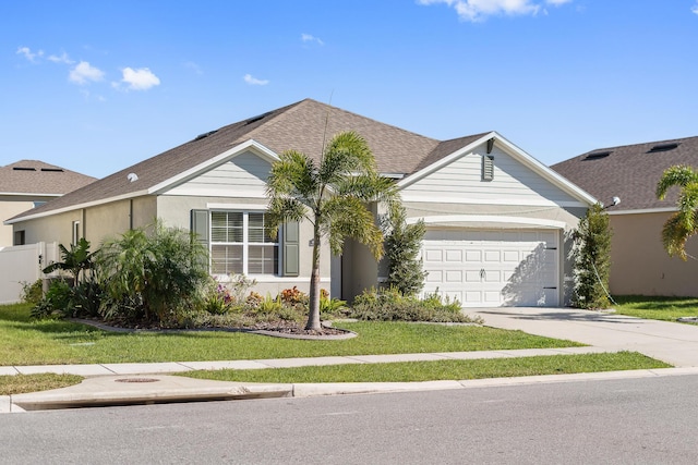 ranch-style home featuring a garage and a front lawn