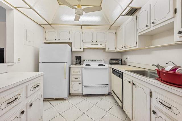 kitchen featuring white appliances, ceiling fan, sink, light tile patterned floors, and white cabinets