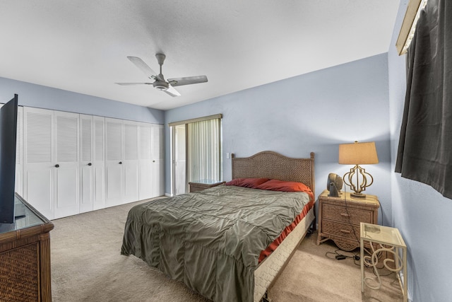 bedroom featuring ceiling fan, a closet, and carpet floors