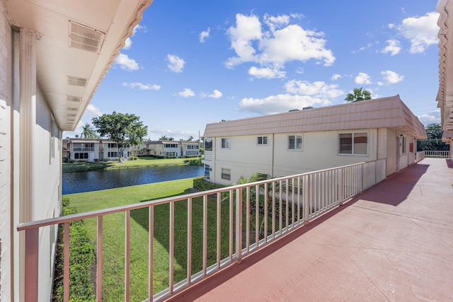 balcony featuring a water view