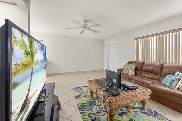 tiled living room featuring ceiling fan