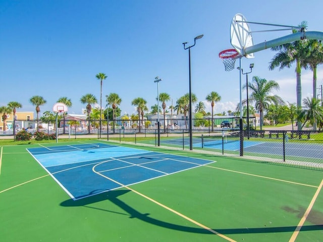 view of sport court featuring tennis court