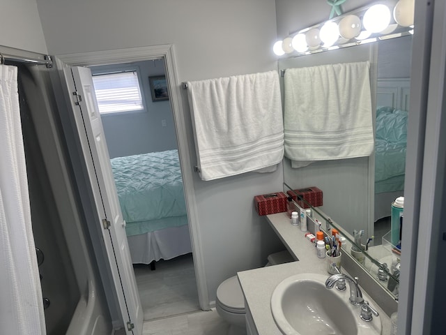 full bathroom featuring sink, shower / bathtub combination, and toilet