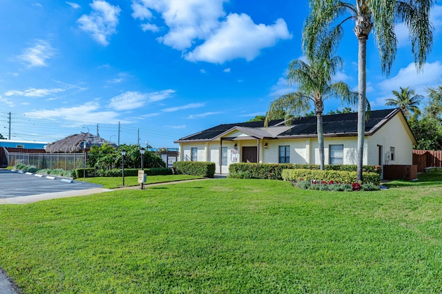 single story home with a front yard