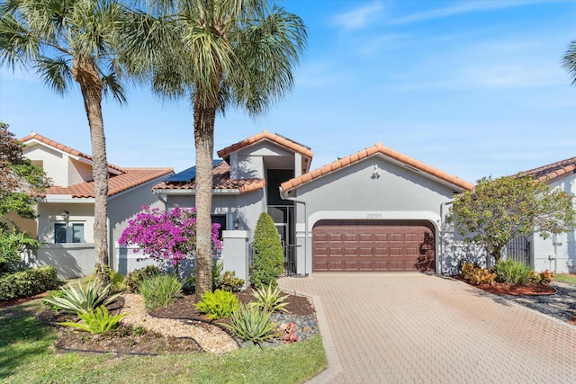 mediterranean / spanish-style home featuring a garage