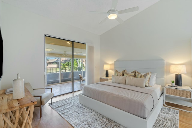 bedroom with hardwood / wood-style floors, access to outside, vaulted ceiling, and ceiling fan