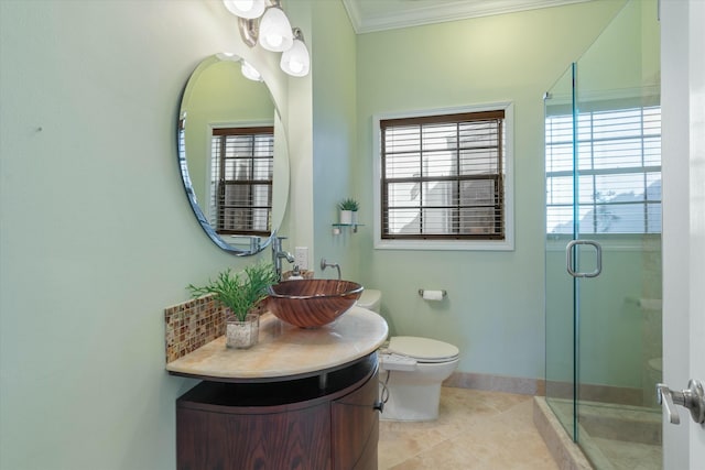 bathroom featuring walk in shower, tile patterned flooring, toilet, vanity, and ornamental molding