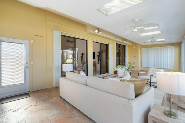 living room featuring a skylight