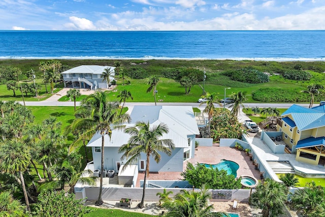 aerial view with a view of the beach and a water view