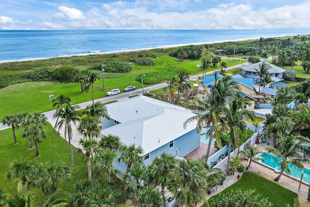 birds eye view of property with a view of the beach and a water view