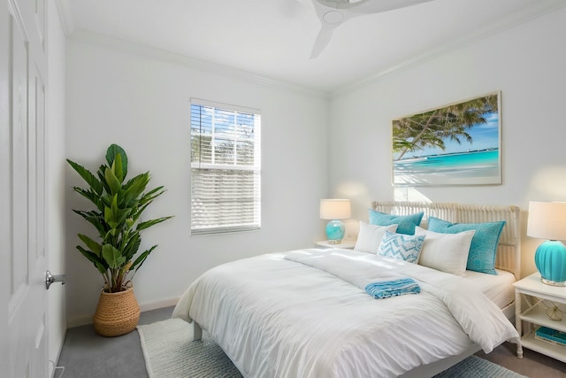 bedroom featuring carpet flooring, ceiling fan, and crown molding