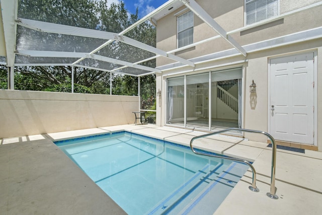 view of pool featuring a lanai and a patio