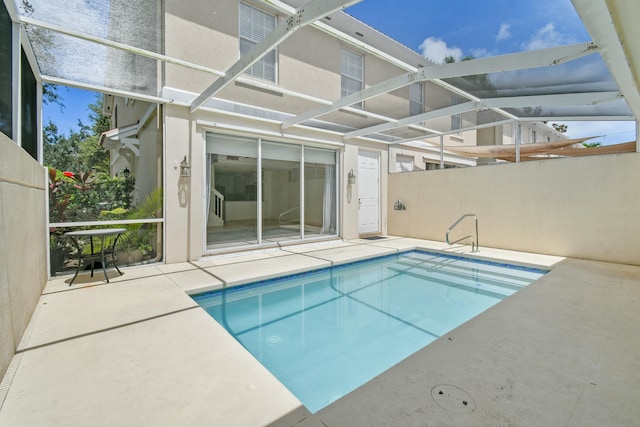 view of pool featuring a patio area and a lanai