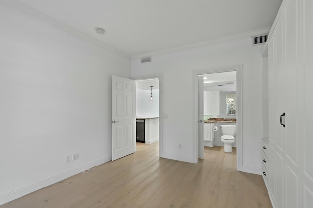 unfurnished bedroom with ensuite bathroom, light hardwood / wood-style floors, and crown molding