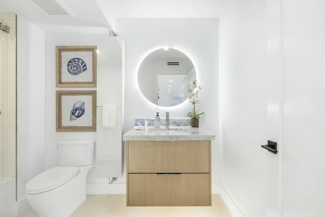 bathroom with walk in shower, tile patterned floors, vanity, and toilet