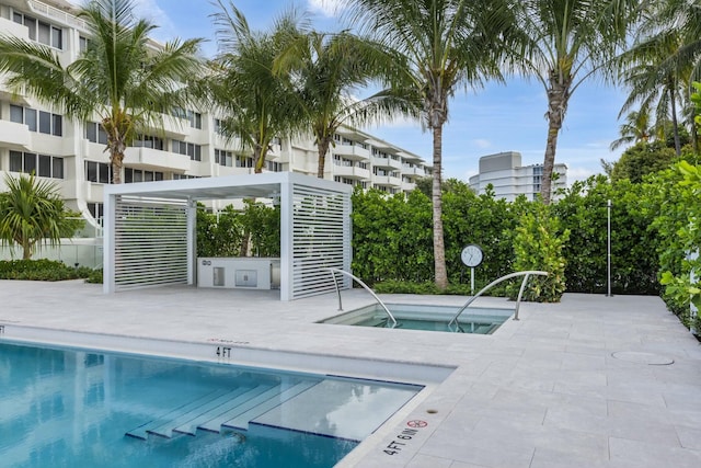 view of pool featuring a hot tub