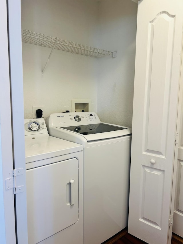 laundry room featuring separate washer and dryer