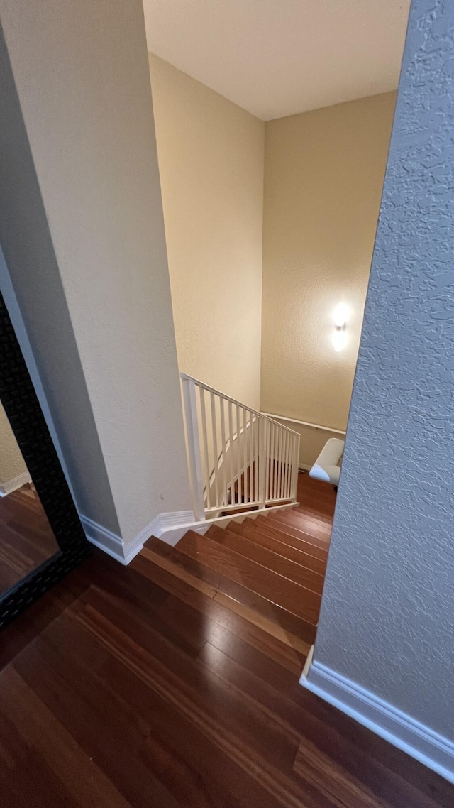 staircase featuring hardwood / wood-style flooring