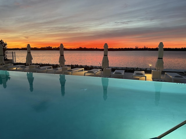 view of pool with a water and mountain view