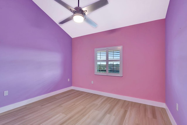 unfurnished room with ceiling fan, vaulted ceiling, and light hardwood / wood-style flooring