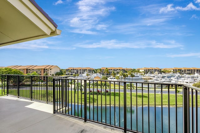 balcony featuring a water view