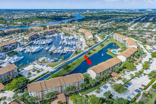 birds eye view of property with a water view