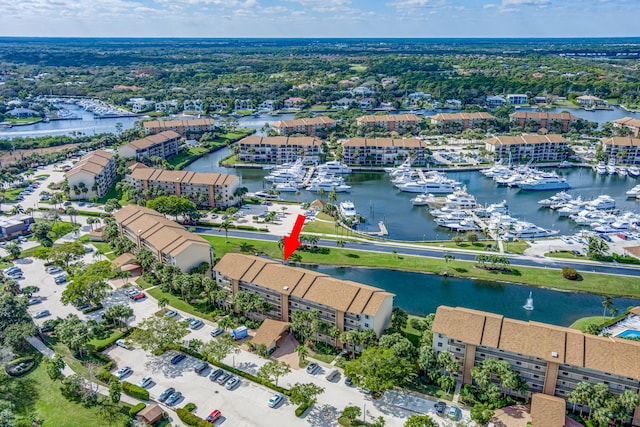 birds eye view of property featuring a water view