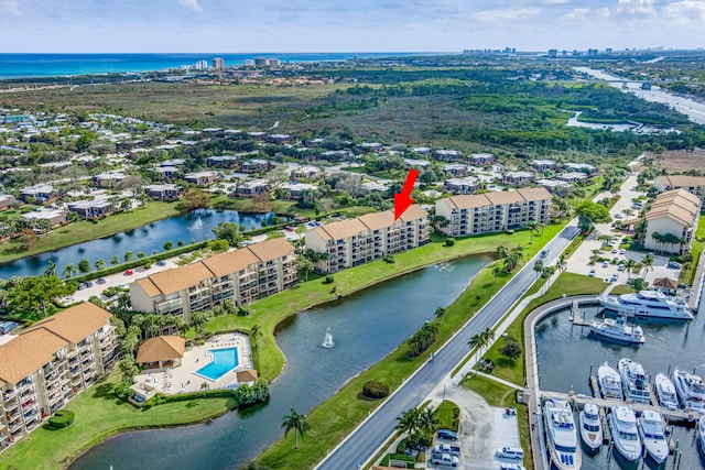 birds eye view of property with a water view