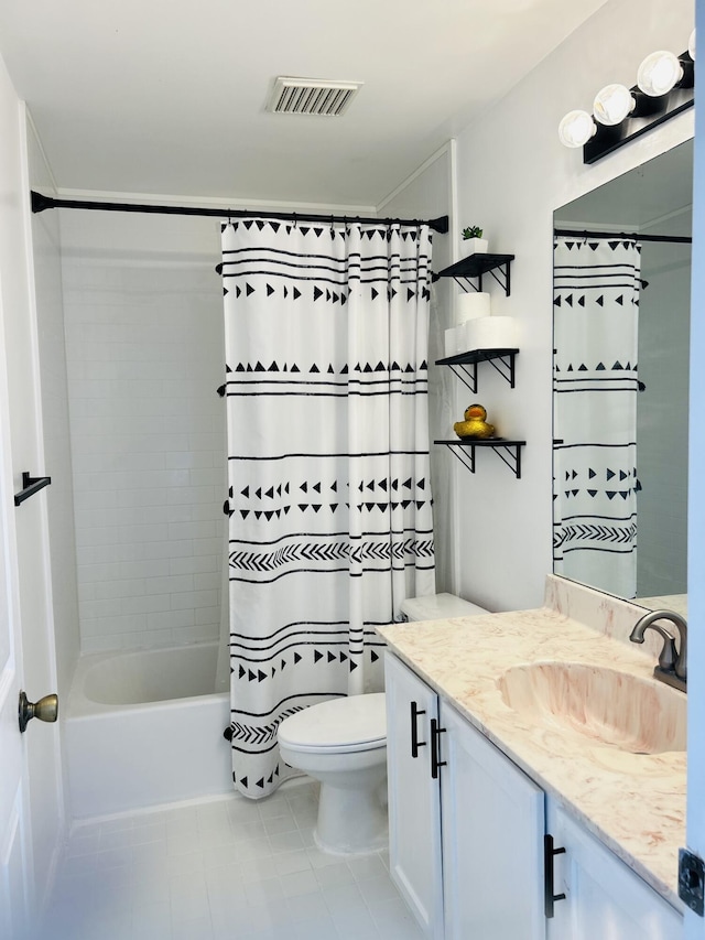 full bathroom with tile patterned floors, vanity, toilet, and shower / bath combo