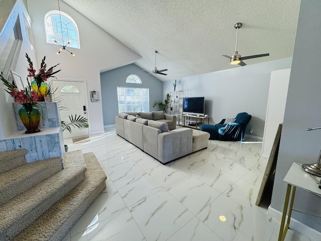 living room with a textured ceiling and lofted ceiling