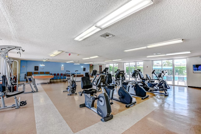 workout area with a textured ceiling