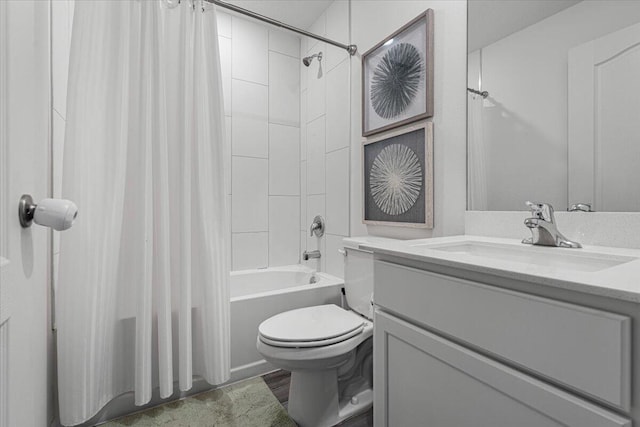 full bathroom with toilet, shower / bath combination with curtain, and vanity