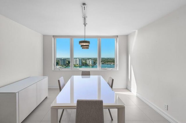 dining area with light tile patterned floors