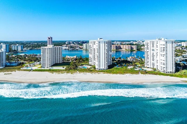 aerial view featuring a water view and a beach view