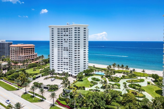 drone / aerial view featuring a view of the beach and a water view