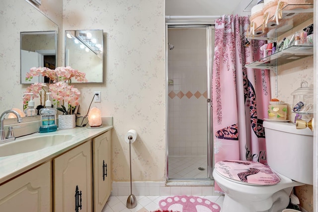 bathroom with tile patterned flooring, vanity, toilet, and a shower with door