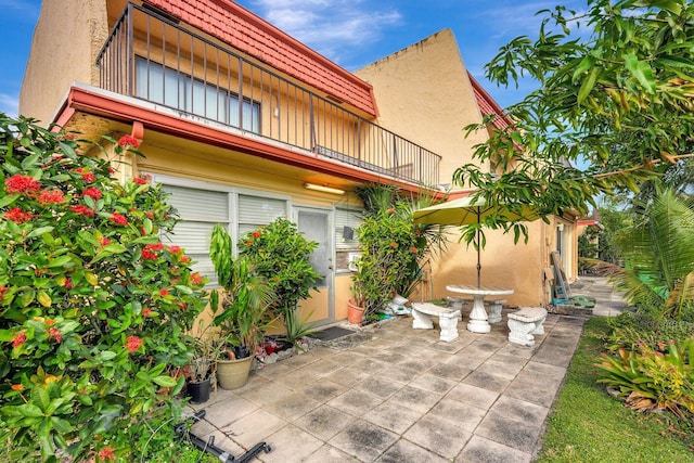 view of patio / terrace with a balcony