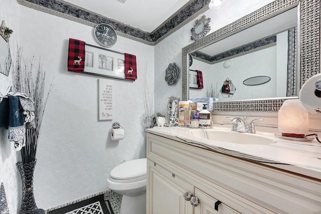 bathroom with vanity and toilet