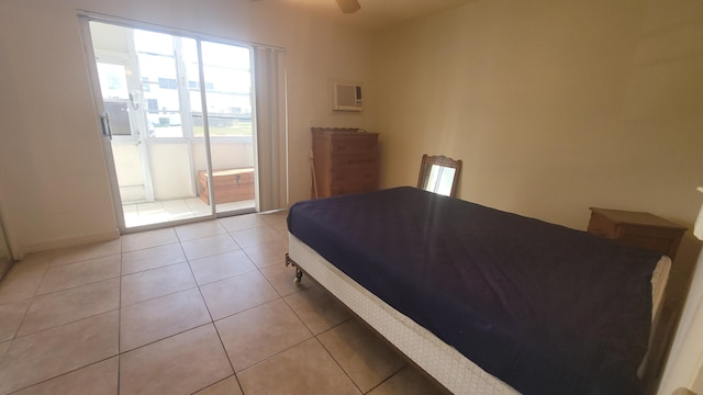 tiled bedroom featuring ceiling fan