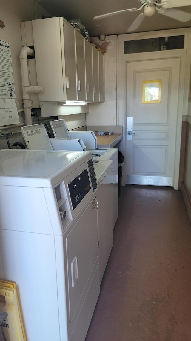 laundry area featuring ceiling fan, cabinets, and separate washer and dryer